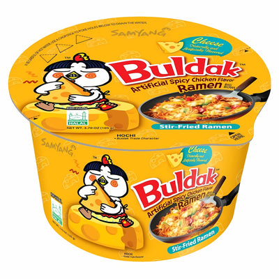 A yellow bowl of Samyang - Buldak Hot Chicken & Cheese Flavour Ramen (Halal, 105g) with cartoon chicken and cheese illustrations on the packaging.