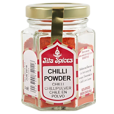 Sita Spices - Chilli Powder - 30g comes in a hexagonal glass jar with a gold lid and multilingual label, adding authentic, vibrant flavor to your kitchen.