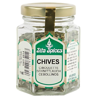 Sita Spices - Chives - 8g comes in a glass jar with a gold lid and multilingual labels (English, French, German, Spanish)—a versatile kitchen staple for adding fresh chive flavor to dishes.