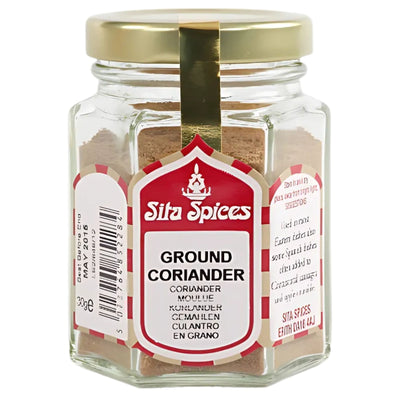 Sita Spices - Ground Coriander (28g), in a glass jar with a gold lid and multilingual label, perfect for adding authentic flavor to Eastern dishes. Shown on a white background.