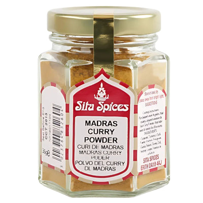 Sita Spices - Madras Curry Powder - 30g comes in a glass jar with a gold lid and multilingual label, offering an authentic blend of spices ideal for rich, flavorful curries.