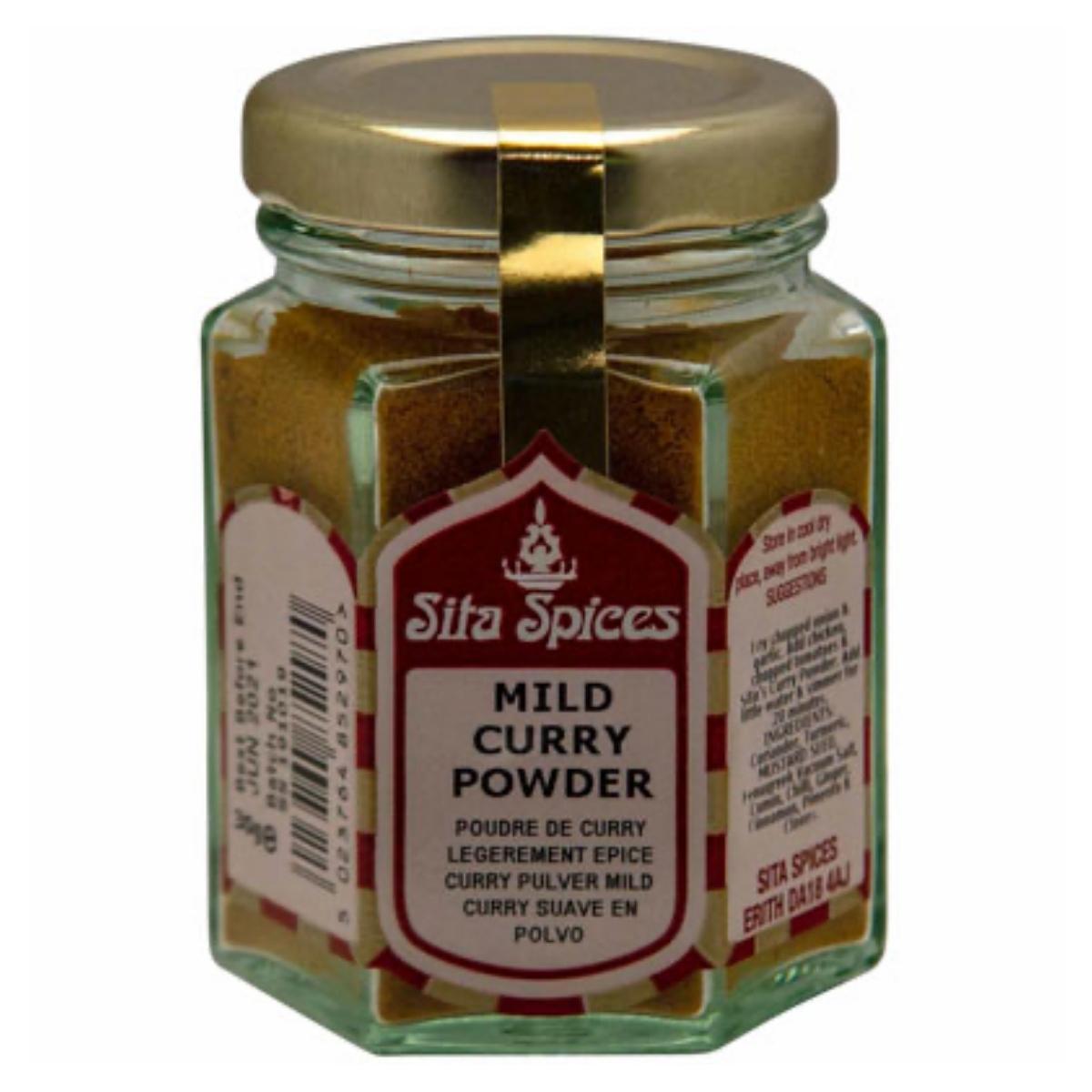 30g glass jar of Sita Spices Mild Curry Powder, adorned with a gold lid and product labels that elegantly showcase the ingredient details and aromatic flavor usage information.