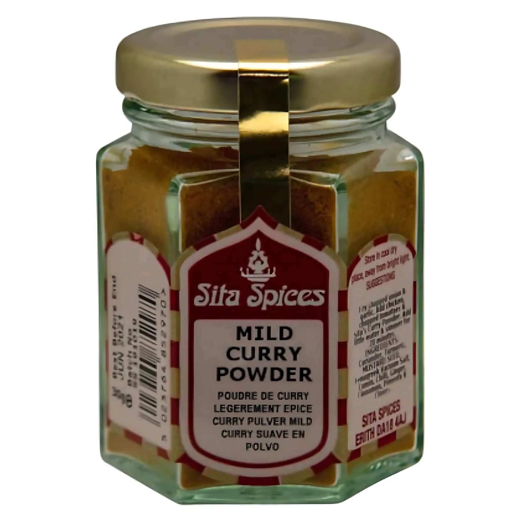 A 30g hexagonal glass jar with a gold lid, filled with Sita Spices - Mild Curry Powder. The label displays the product name and description in several languages, celebrating aromatic spices in every blend.