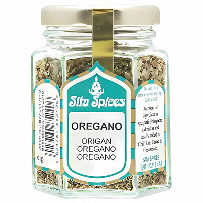 A 10g glass jar of Sita Spices Oregano with a gold lid and turquoise label featuring the product name in multiple languages—an essential for any kitchen.