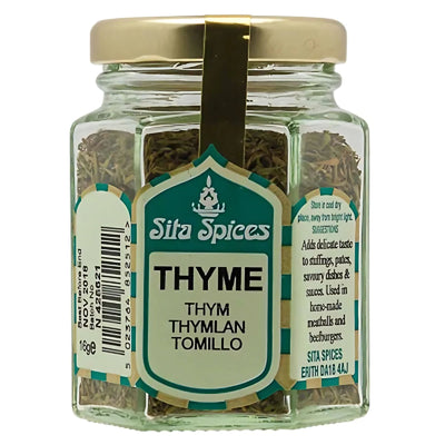 A 16g glass jar of Sita Spices Thyme with a green and white label and gold lid—ideal for seasoning meats and adding flavor to your favorite dishes.