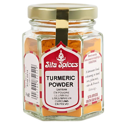 A 30g Sita Spices Turmeric Powder hexagonal glass jar with a gold lid, red and white multilingual labels, and natural health benefits highlighted.