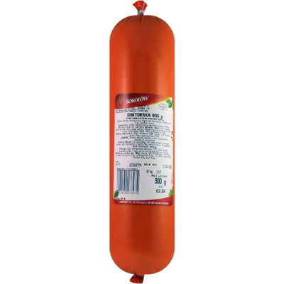 Sokolow - Doktorska - 900g is a cylindrical Polish sausage with an orange casing and a white label in Polish, ideal for anyone looking for premium deli meat.