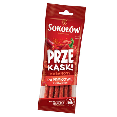 A red plastic package of Sokolow - Pepper Snack Stick Kabanos with Chilli - 80g, thin dried meat sticks featuring images of chili peppers and text in Polish.