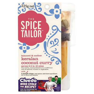 The Spice Tailor Keralan Coconut Curry Kit (225g, serves 2-3) includes authentic Indian spices and features a Cluedo promotion on the packaging—perfect for making a delicious homemade curry. Label and ingredients are clearly visible.