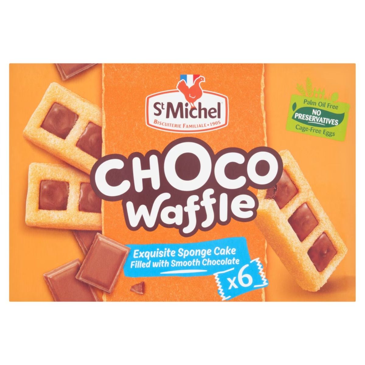 Box of StMichel Choco Waffle (180g), featuring delectable sponge cakes filled with rich chocolate. Contains six pieces. Labels emphasize that it is palm oil-free, has no preservatives, and is made with cage-free eggs.