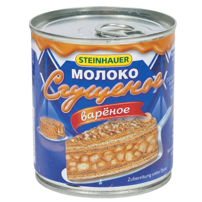 A Steinhauer Condensed Boiled Milk 397g metal can featuring a graphic of a layered nut cake on the label.