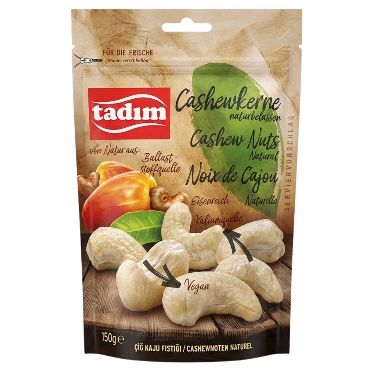 A 150g resealable pack of Tadim Unroasted Natural Cashew Nuts, with images of whole cashews and product info in German, English, and French on the front.