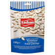 A 150g pack of tadim Roasted & Salted Pumpkin Seeds, rich in plant-based protein. The packaging displays salted pumpkin seeds and product info in several languages.
