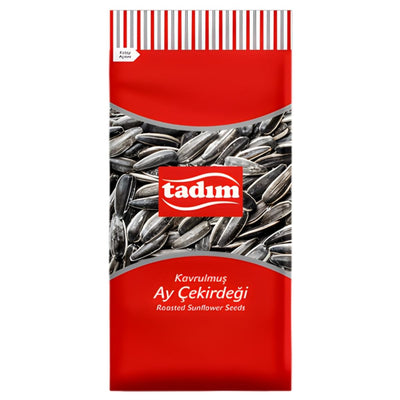 A 150g tadim Roasted & Salted Sunflower Seeds pack, red and white with Turkish and English labeling, features an image of sunflower seeds on the front.