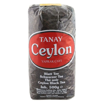 A 500g package of Tenay Ceylon Loose Black Tea features a distinctive red and white label with multilingual text. Sourced directly from Sri Lanka, this premium tea delivers a rich and authentic Ceylon black tea experience.