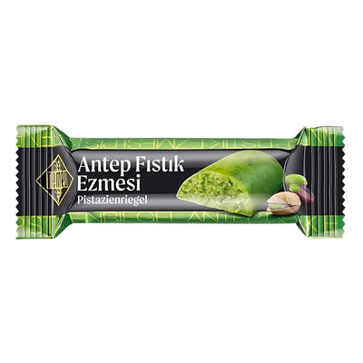 Tempo Pistachio Paste Bar (24g) features a partially bitten bar and creamy pistachios on its wrapper, making it a tasty snack option.