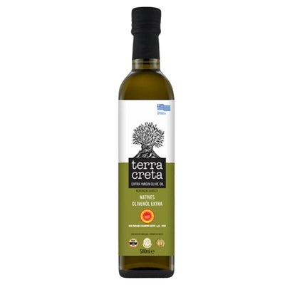 A 500ml bottle of Terra Creta - Premium P.D.O Kolymvari Extra Virgin Olive Oil, featuring a black cap, green label with an olive tree illustration, quality certification logos, and assurance of premium extra virgin olive oil.
