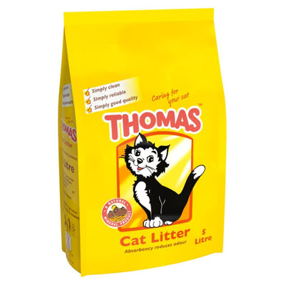 A 5L yellow bag of Thomas Cat Litter by Thomas, featuring a cartoon black and white cat and product info on the front.