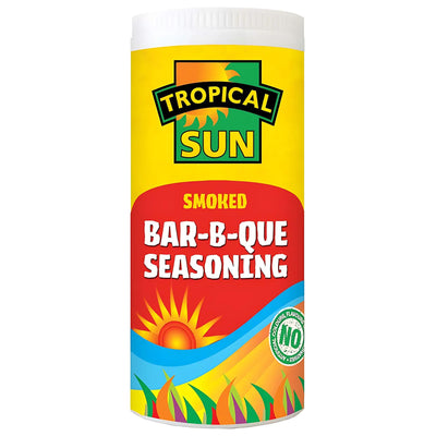 A 100g container of Tropical Sun Bar-B-Que Seasoning with a colorful label features a sun, hills, and “NO artificial flavor,” blending tropical spices for a bold smoked barbecue seasoning flavor.