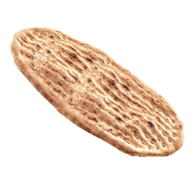 An oval-shaped, golden-brown Twins Bakery - Turkish Lavas Flatbread - 450g with an indented, patterned surface.
