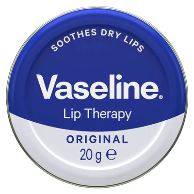 Vaseline Lip Therapy Original (20g) by Vaseline comes in a round tin with a blue and white lid stating "Soothes Dry Lips"—ideal for combating dry lips.