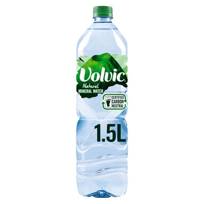 A 1.5L bottle of Volvic Natural Mineral Water featuring a green cap and a carbon neutral label from the Volvic brand.