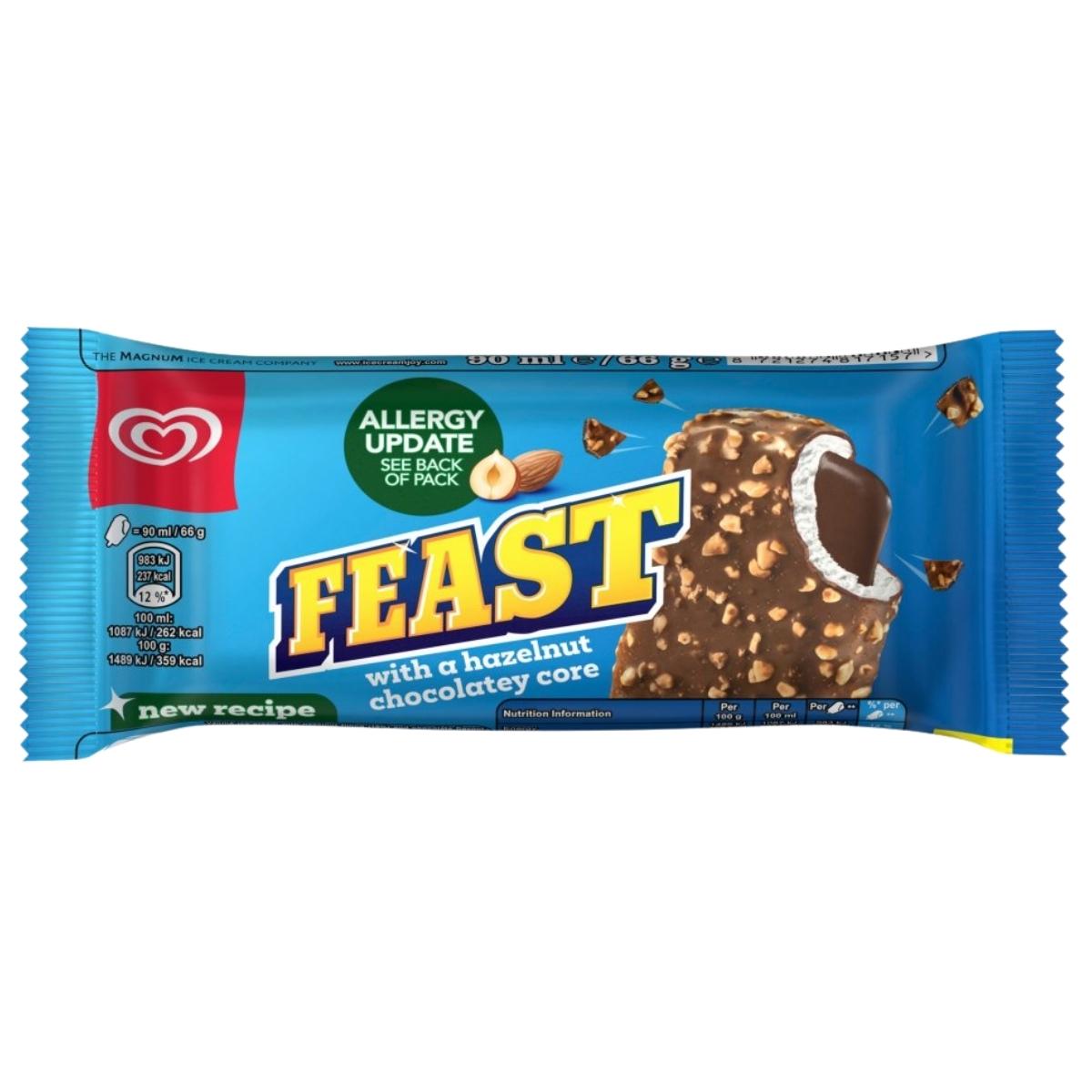 Blue packaging of Feast chocolate bar with a hazelnut chocolatey core on a white background