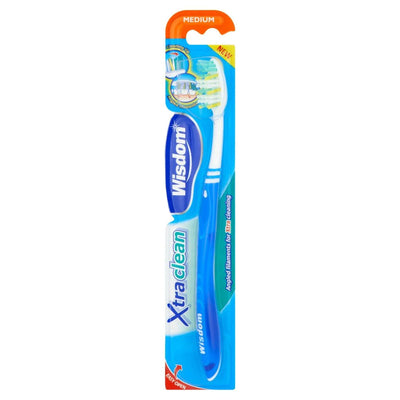 A packaged Wisdom Xtra Clean Angled Filaments Toothbrush (medium, blue) features angled bristles for deep cleaning.