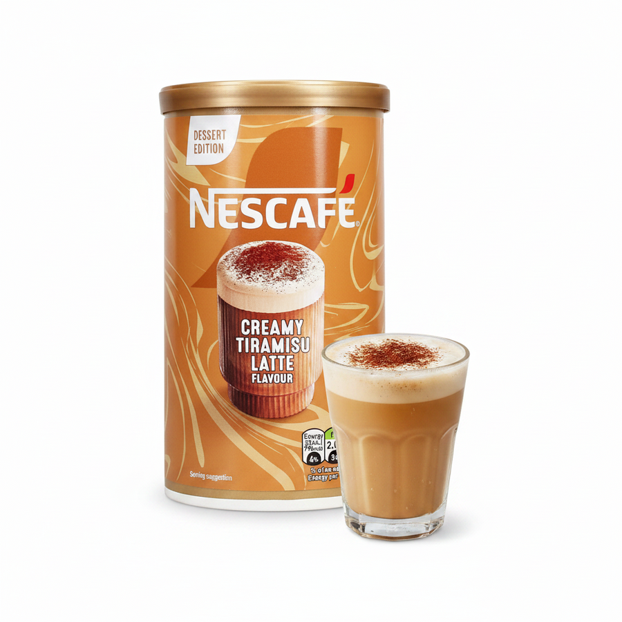 A Nescafe Creamy Tiramisu Latte Flavour canister next to a glass of the prepared coffee drink, set against a clean white background.