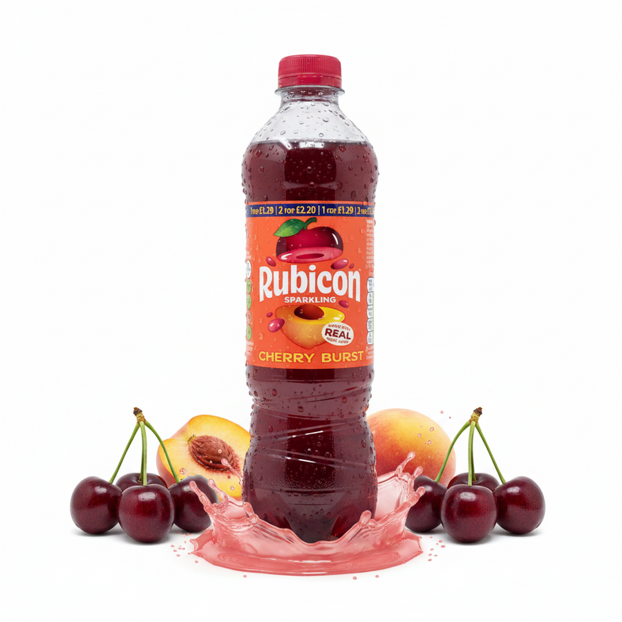 A 500ml bottle of Rubicon - Cherry Burst stands upright, encircled by fresh cherries, peach halves, and a vibrant splash of red liquid on a white background.