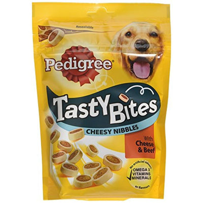 A yellow resealable 140g pack of Pedigree Tasty Minis Cheese & Beef Nibbles dog treats with a dog image and product info on the front.