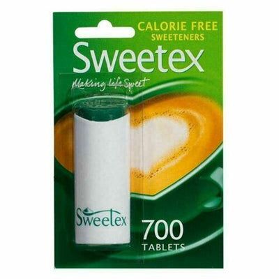 A pack of Sweetex Sweeteners with 600 calorie-free tablets, by Sweetex, features green packaging and a cup of coffee image in the background.