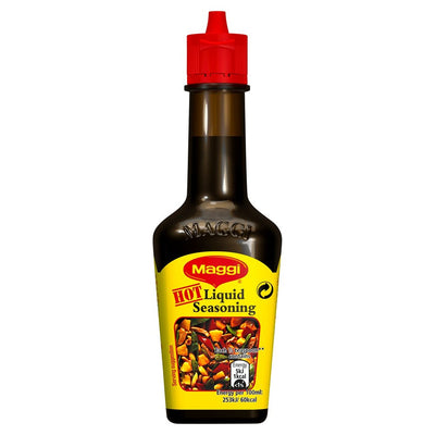 A 100ml bottle of Maggi - Liquid Seasoning Hot features a red cap and a yellow label with product details and food images.