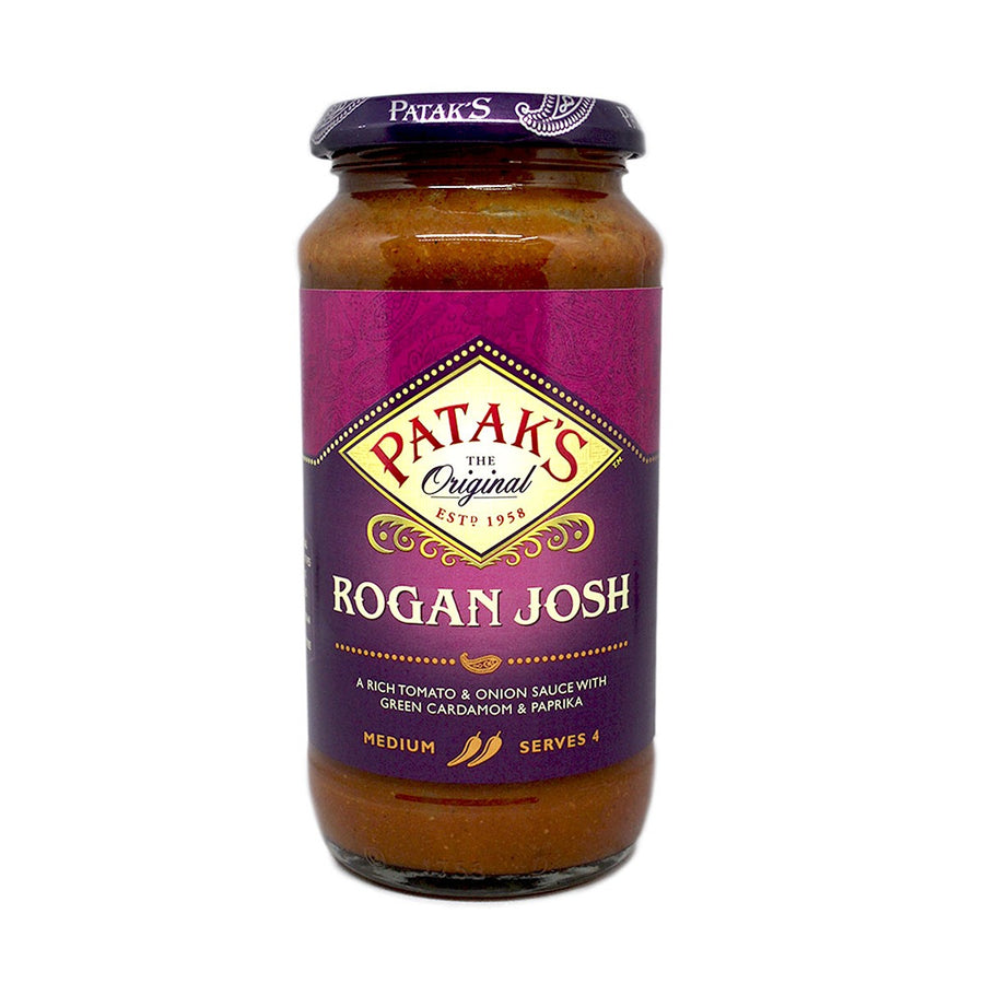 A 450g jar of Patak's Rogan Josh Cooking Sauce, labeled "medium" and "serves 4," is perfect for making authentic Indian curry at home.
