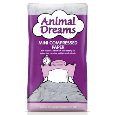 Animal Dreams - Compressed Paper - Mini features creative bedding for small animals in purple and white packaging with a pillow illustration.