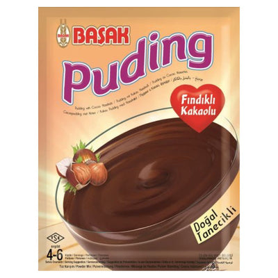 A Basak - Hazelnut & Chocolate Pudding (110g) pack shows a bowl of creamy chocolate pudding with whole hazelnuts, labeled “Fındıklı Kakaolu” and “Doğal Tanelikli.”.