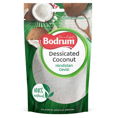 A 75g Bodrum branded desiccated coconut pack in green and white, labeled "100% natural," with no artificial colors or additives and featuring coconut imagery.
