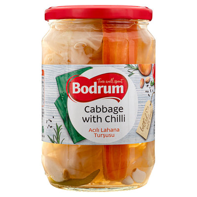 A jar of Bodrum - Cabbage with Hot Pepper - 670g contains pickled cabbage and carrots, distinguished by its red lid and a product label displaying herbs and spices.
