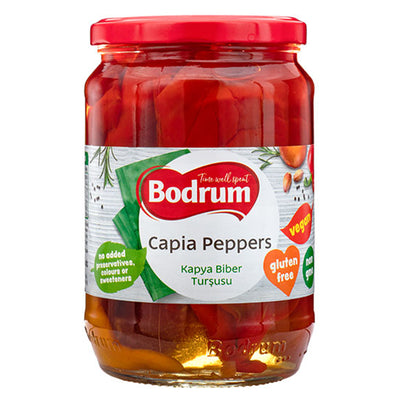 A 650g jar of Bodrum Pickled Kapia Peppers with a red lid, labeled vegan, gluten-free, and free from added preservatives or sweeteners.