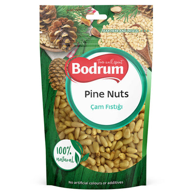 A standing 50g package of Bodrum Pine Nuts, with visible pine nuts and pine cones on the packaging, labeled "100% natural" and "No artificial colours or additives.
