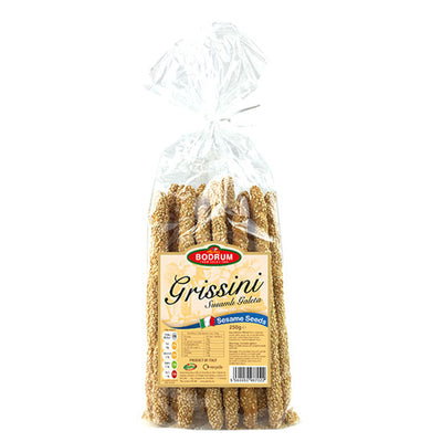 A clear plastic bag of Bodrum - Grissini Sesame - 250g shows the label on the front; these crunchy breadsticks are coated with sesame seeds for a delicious snack.