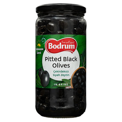 A 720g jar of Bodrum Pitted Black Olives with a green and black label featuring olives and bilingual English-Turkish product information.