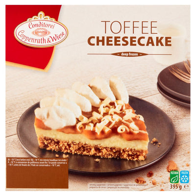 The packaging for Conditorei Coppenrath & Wiese Toffee Cheesecake (395g) features a slice topped with whipped cream and white chocolate curls on a black plate.