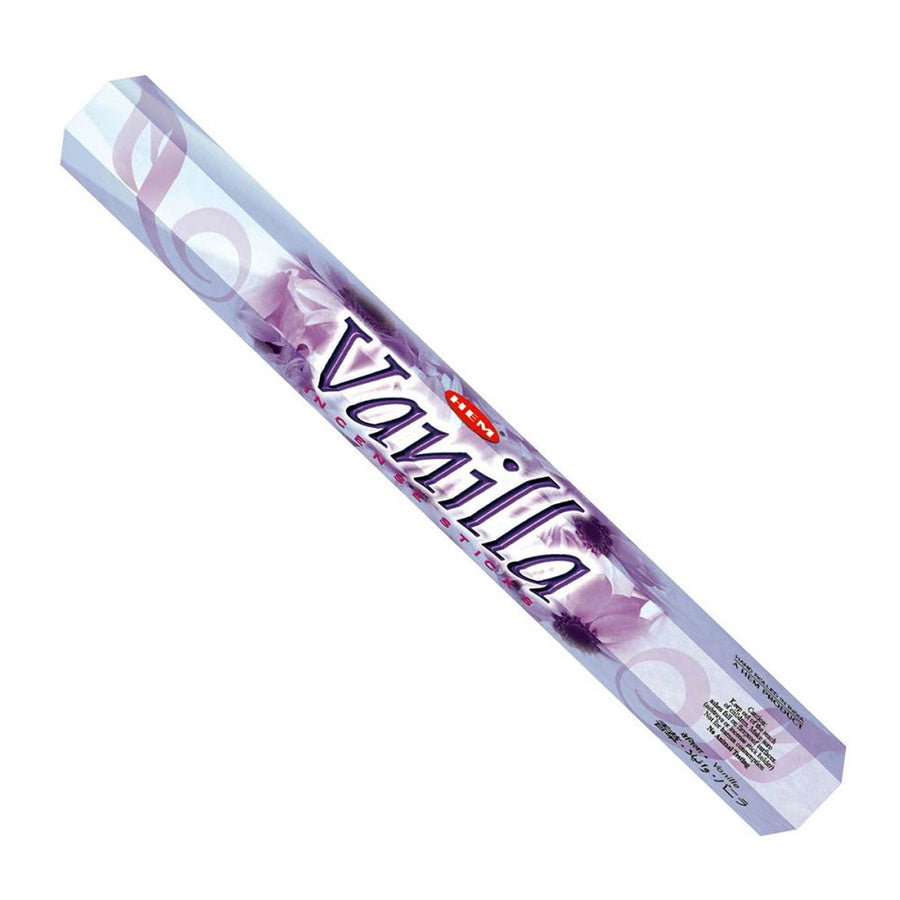 A hexagonal box labeled "HEM - Vanilla Incense - 20 Stick" from HEM, with a purple and white design, features swirling graphics—perfect for creating a relaxing atmosphere with its soothing vanilla scent.