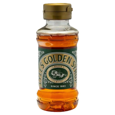 Lyle's Golden Syrup 325g comes in a plastic bottle with a green and gold label and a gold flip-top cap, filled with amber syrup ideal for British baking.